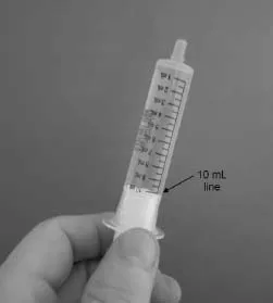 Check the oral syringe to make sure it is filled with water up to the 10 mL line Illustration